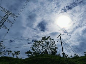 Low angle view of electricity pylon against sky