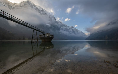 Scenic view of lake against sky during winter