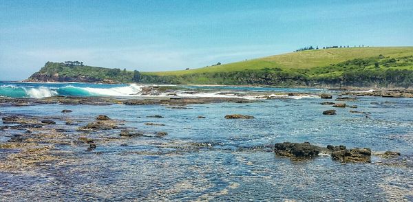 Scenic view of sea against blue sky