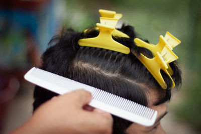 Close-up of man working on mobile phone