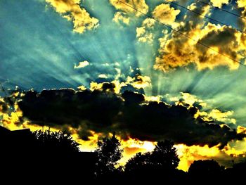 Low angle view of dramatic sky at sunset