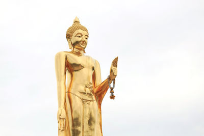 Low angle view of statue against sky