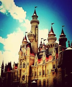 Buildings against blue sky and clouds