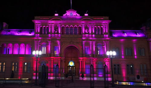 Low angle view of illuminated building at night