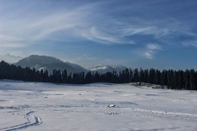 Scenic view of snow covered landscape against sky