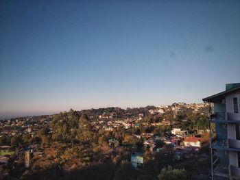 High angle view of townscape against clear blue sky