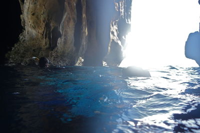 Panoramic view of sea and rocks against sky