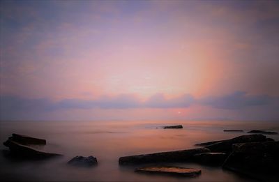 Scenic view of sea against sky during sunset