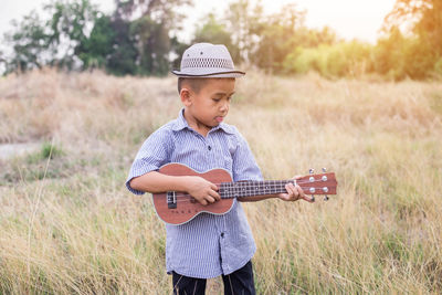 Full length of a man playing guitar