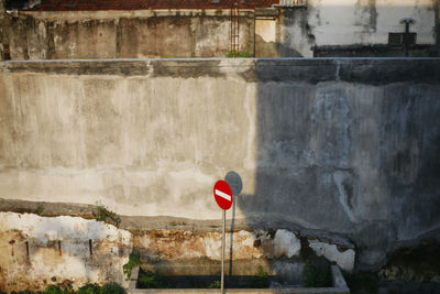 Road sign on wall