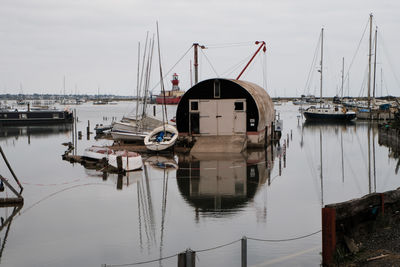 Boats moored at harbor