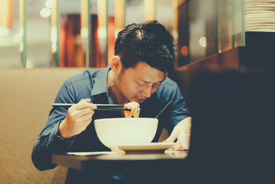 Young man eating food