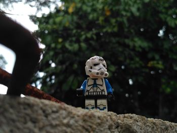 Low angle view of statue against trees