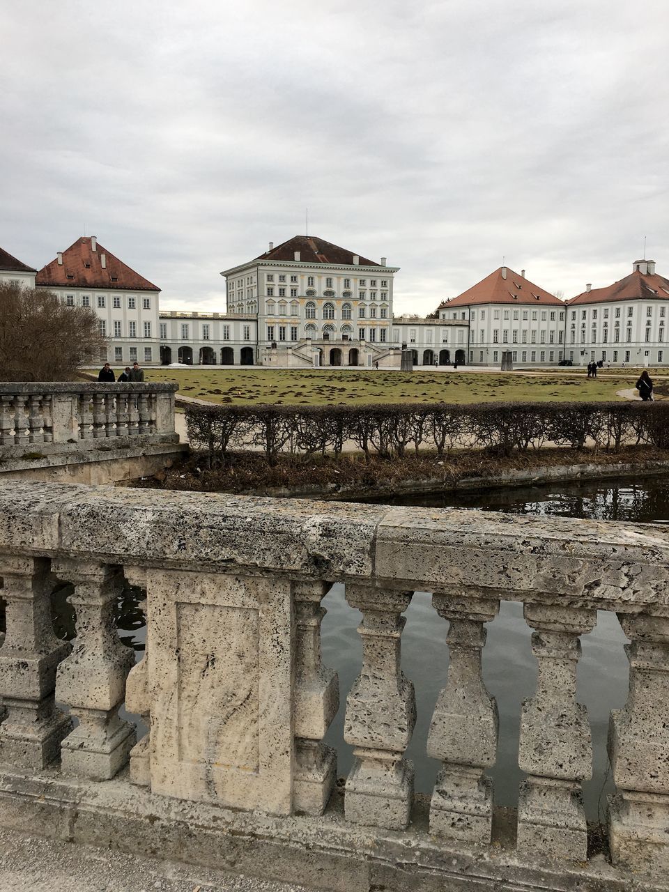 BUILDINGS AGAINST CLOUDY SKY