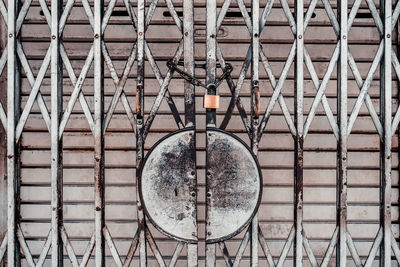 Full frame shot of closed metallic gate