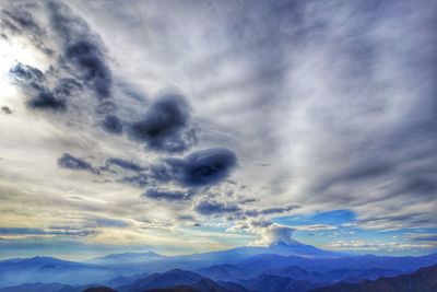 Low angle view of mountains against dramatic sky