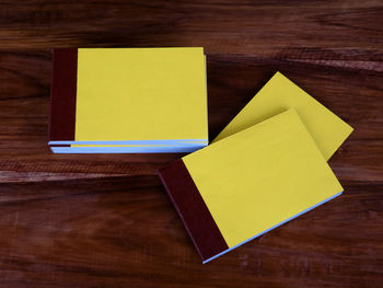 High angle view of yellow paper on table