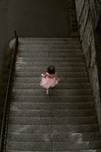 High angle view of woman walking on footpath