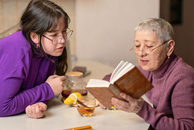 Young woman using digital tablet at home