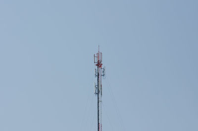 Low angle view of communications tower against sky