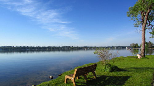 Scenic view of lake against blue sky