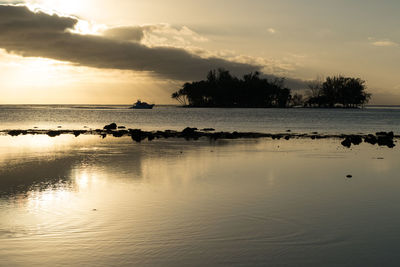 Scenic view of sea against sky at sunset