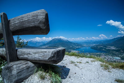 Scenic view of lake and mountains against blue sky