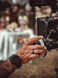 Close-up of man photographing