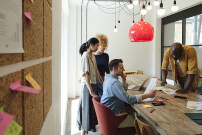 Creative business people having meeting in modern conference room discussing solutions