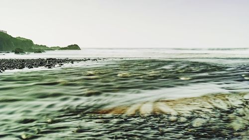 Scenic view of sea against clear sky