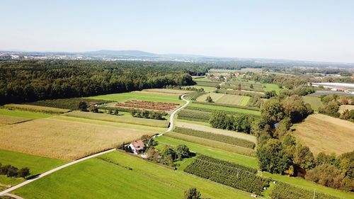 High angle view of green landscape against sky