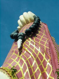 Low angle view of statue against clear blue sky