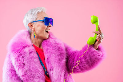 Portrait of woman holding dental equipment