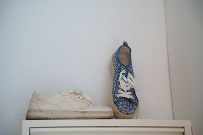 Close-up of clothes hanging on wall