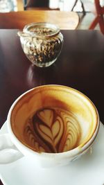 Close-up of cappuccino on table