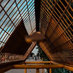 Low angle view of people on ceiling in building