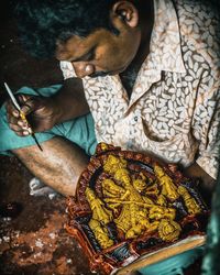 High angle view of man holding food