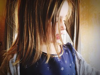 Close-up of cute girl with brown hair