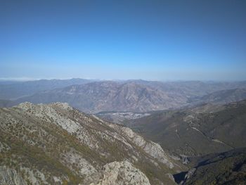 Scenic view of mountains against clear blue sky