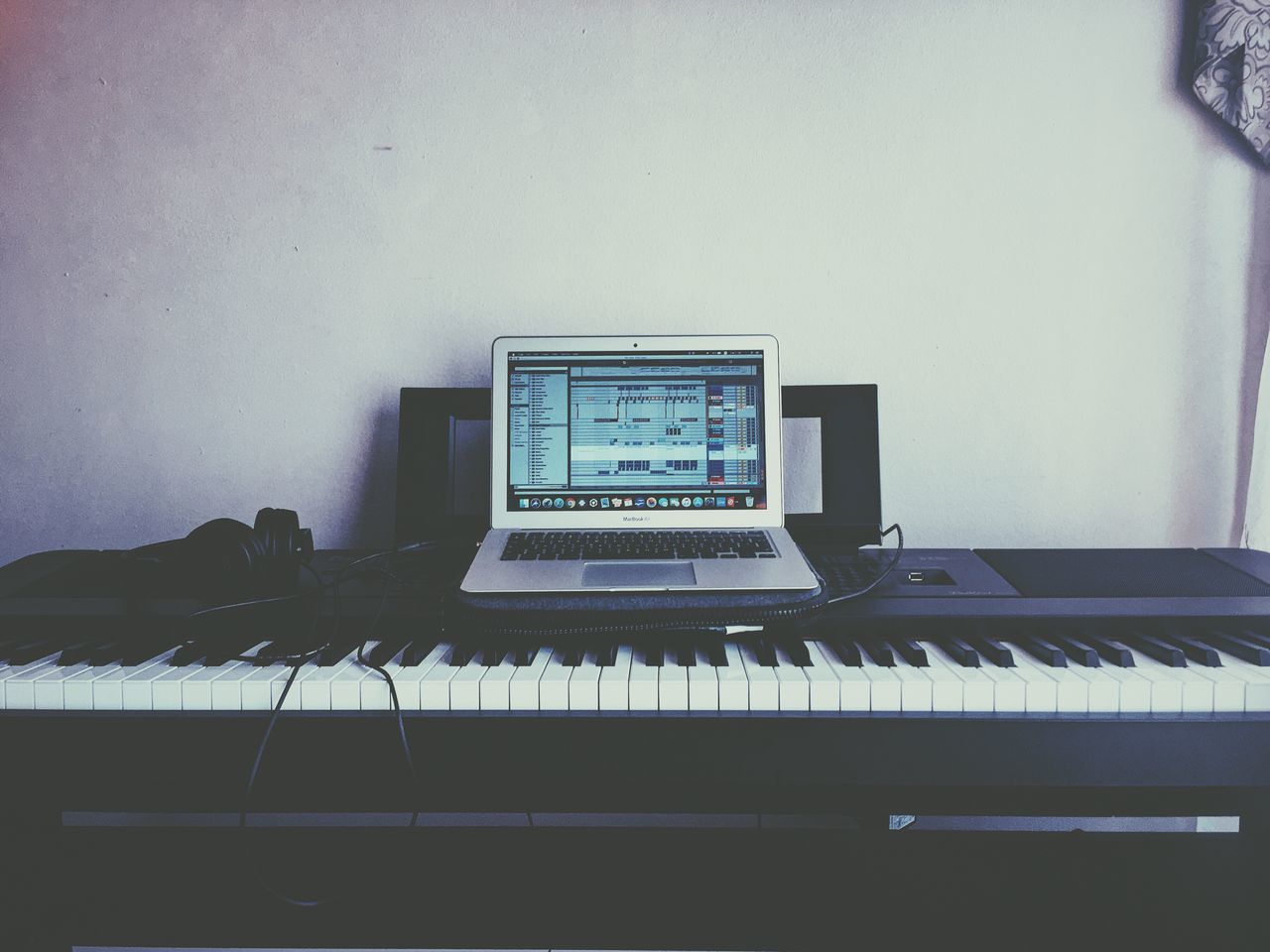 musical equipment, music, musical instrument, indoors, keyboard, piano, no people, technology, arts culture and entertainment, piano key, computer, keyboard instrument, computer equipment, wall - building feature, absence, computer monitor, white color, communication, connection, close-up, electrical equipment