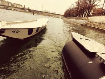 Boats moored in water