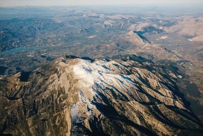 Aerial view of landscape against sky during winter