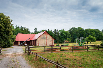 Beautiful view of the polish horse stud in florianka. a large barn in the background. 