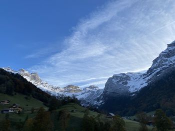 Scenic view of snowcapped mountains against sky