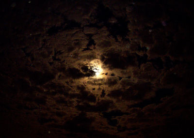 Low angle view of moon in sky at night