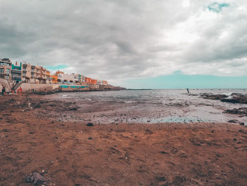 Scenic view of beach against sky