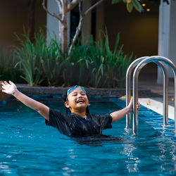 Close-up of cute girl in swimming pool