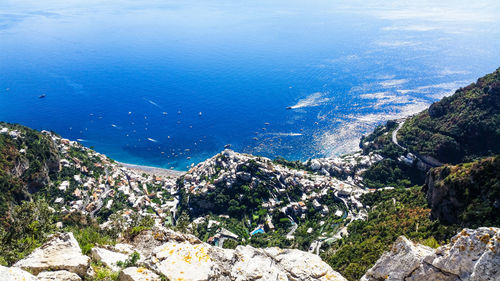 High angle view of rocks on sea shore