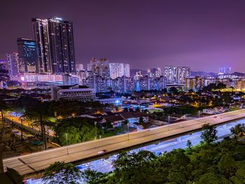 Illuminated buildings in city at night