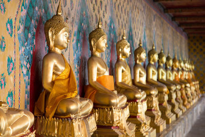 Buddha statues in row